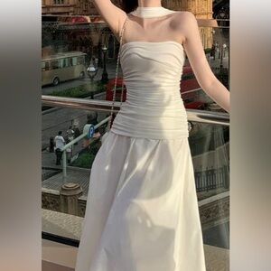 Elegant White Strapless Dress
Similar style as the model’s dress on the pic.